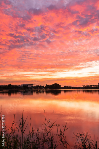 sunset nearly fall from the sky on the horizon reflected into the water