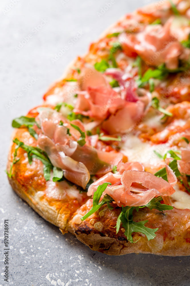 Pinsa with parma ham and aragula, rome pizza. macro close up vertical Pinsa with parma ham and aragula, rome pizza. macro close up vertical