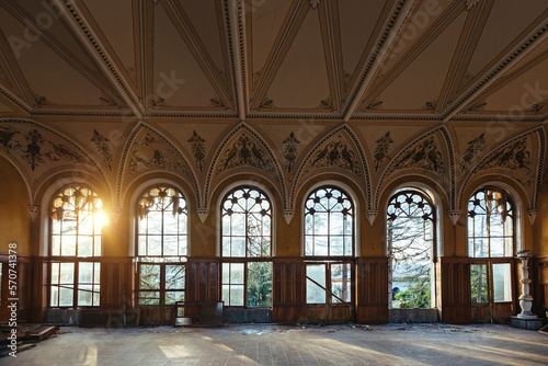 Large hall of abandoned building in gothic style