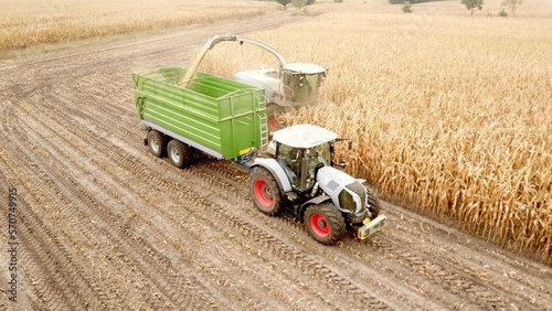 corn harvester, maize chopper working in a field at harvest work, biomass, biogas, energy crop, agriculture, agricultural policy, food production