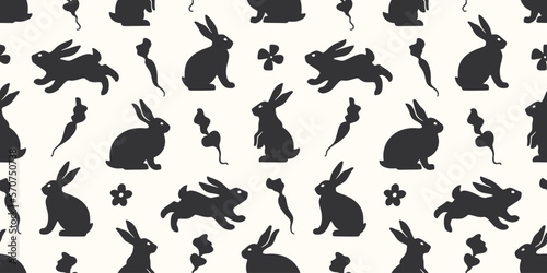 Hand drawn seamless pattern with cute doodle silhouette bunnies. Easter background. Perfect for textile or paper wrapping design. Vector illustration