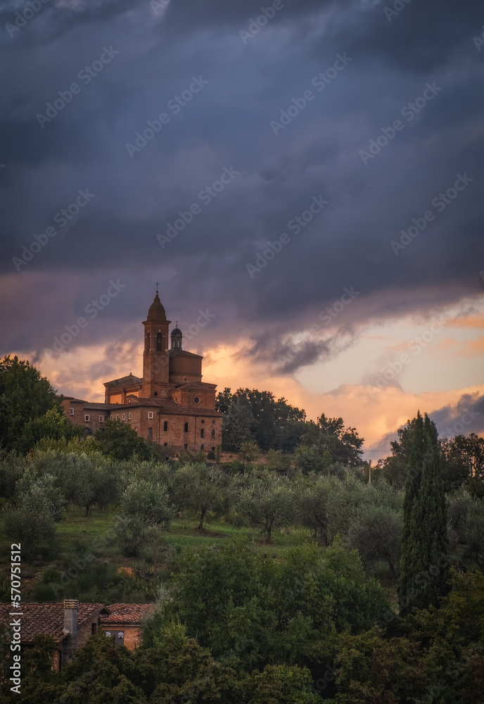 Photo contains sunset view on Basilica dell Osservanza in Siena - Italy. October 2022