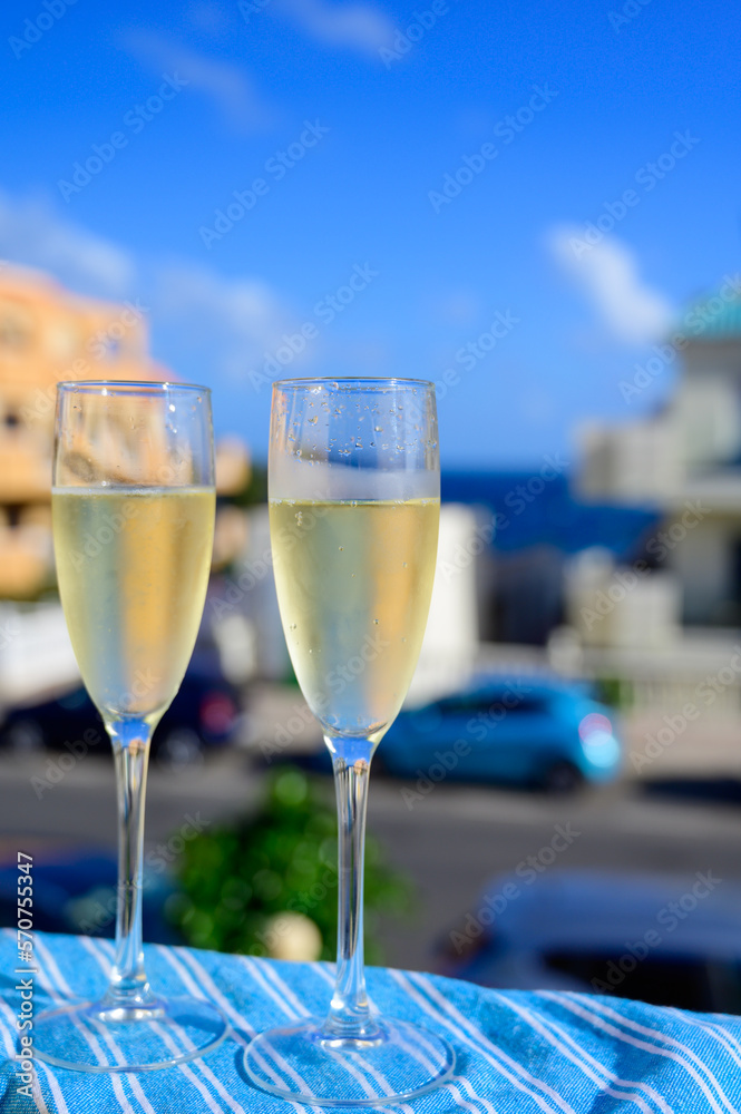 Dinner party, drinking of cava or champagne sparkling wine in vacation resort Caleta Fuste, Fuerteventura, Canary islands vacation, Spain Dinner party, drinking of cava or champagne sparkling wine in vacation resort Caleta Fuste, Fuerteventura, Canary islands vacation, Spain