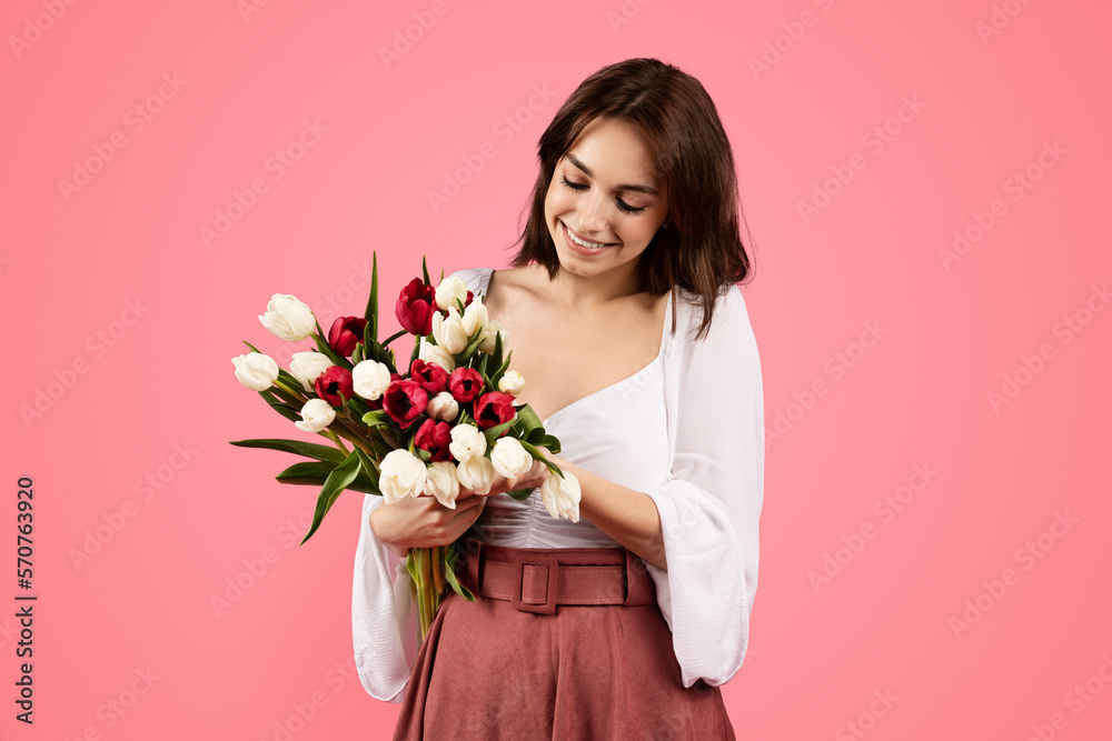 Smiling young european female with bouquet of flowers, enjoy lifestyle, present, rejoice spring festival Smiling young european female with bouquet of flowers, enjoy lifestyle, present, rejoice spring festival
