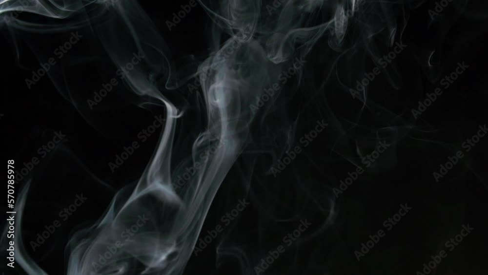 Slow motion of white smoke, fog, mist, vapor on a black background. Slow motion of white smoke, fog, mist, vapor on a black background.