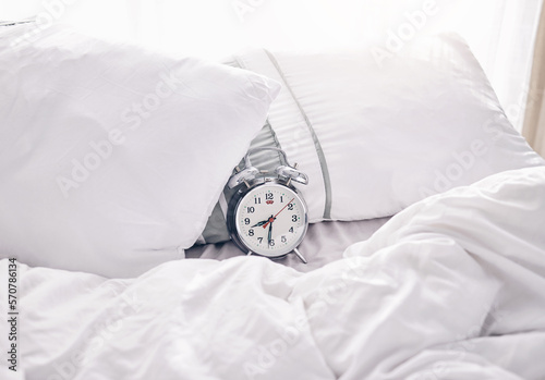 Time, waking up and alarm clock on a bed with no people for punctual, sleeping and hour management. Empty, bedroom and vintage timer for routine, sleep and rest schedule, snooze and resting on mockup