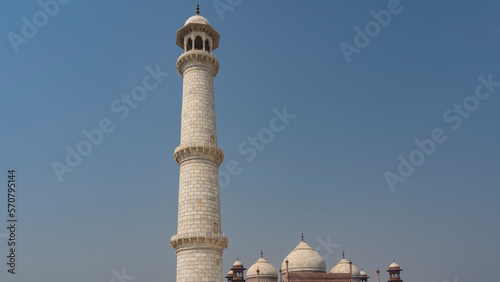 Photography A high white marble minaret against the blue sky