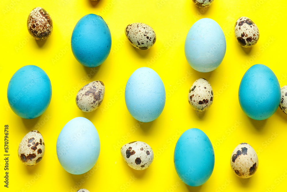 Painted and natural Easter eggs on yellow background Painted and natural Easter eggs on yellow background