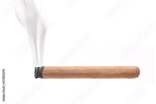 Tobacco long cigar is burning with ash and smoke closed up isolated on white