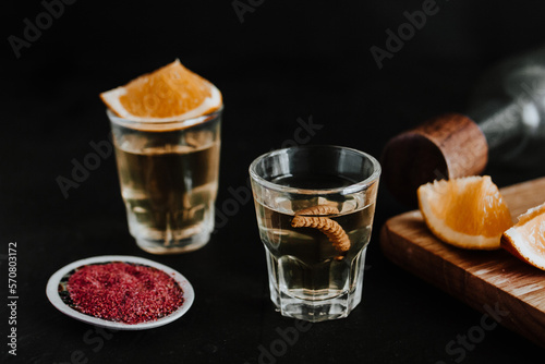 Mexican Mezcal Shots with worm, orange slice and spicy Salt in Mexico Latin America