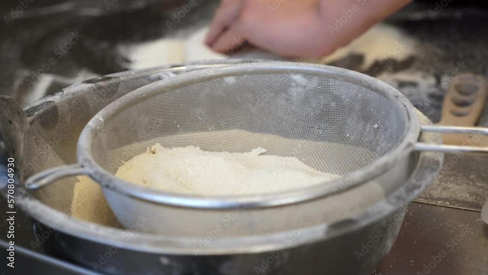 Close-up of the chef's hands form a round pizza base from the dough with his hands. The pizzeria chef kneads the dough for traditional Italian pizza. Close-up of the chef's hands form a round pizza base from the dough with his hands. The pizzeria chef kneads the dough for traditional Italian pizza.