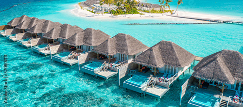 Beautiful Maldives paradise. Tropical aerial travel landscape, seascape with wooden bridge, water villas, amazing sea sand sky beach, tropical island nature. Exotic tourism destination summer vacation © icemanphotos