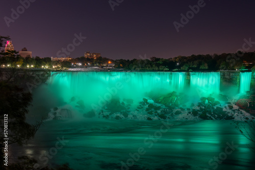 Niagara Falls lit up in green. Ontario, Canada.