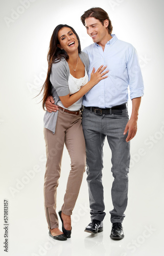 Couple, woman laughing and man portrait in a studio isolated with a happy smile and hug. Calm, happiness and love of a caring male and female model with white background and romance together
