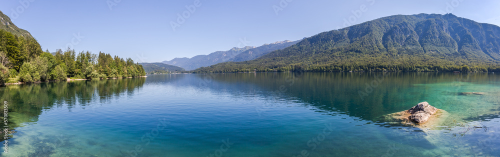 Summer at Lake Bohinj in the Julian Alps - panorama of the lake surrounded by mountains