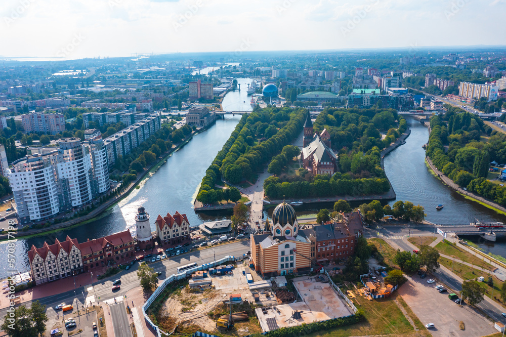 Obraz premium View of city center with canals Kaliningrad, central part with town hall, beautiful park and embankment and a bridge view from a drone