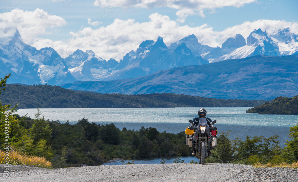 Man riding his touring motorbike at Torres del Paine, Patagonia Man riding his touring motorbike at Torres del Paine, Patagonia