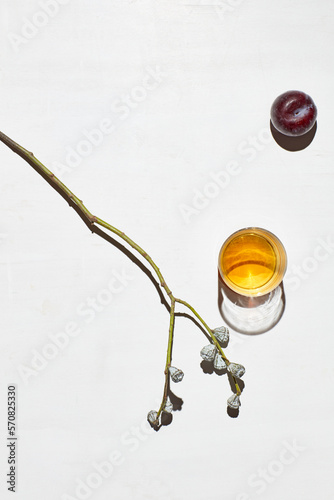 Still life with whiskey, apple, branch photo