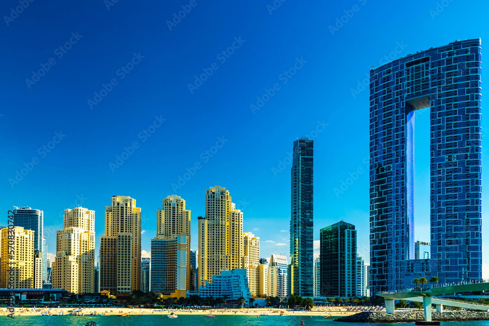 Dubai jumeirah beach with marina skyscrapers in UAE. Popular public JBR beach