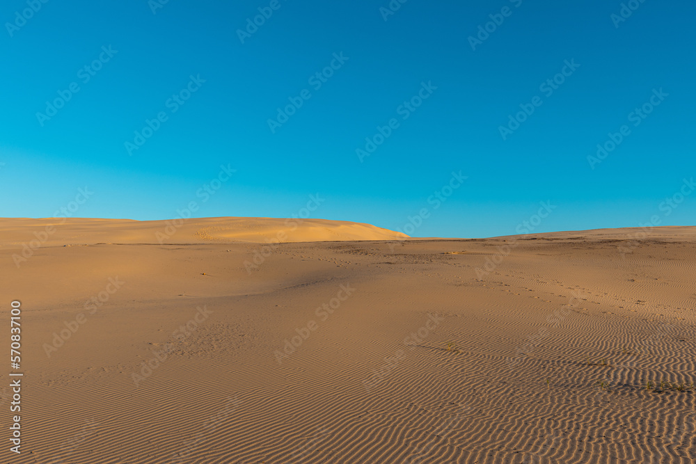 Empty sand dune with blue sky. Empty sand dune with blue sky.