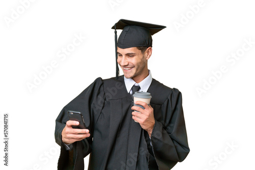 Young university graduate caucasian man over isolated background holding coffee to take away and a mobile