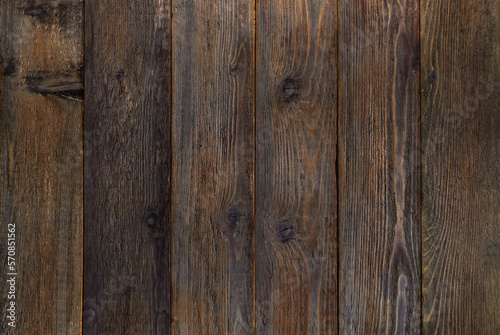 Wooden background texture. old dark brown burnt boards.