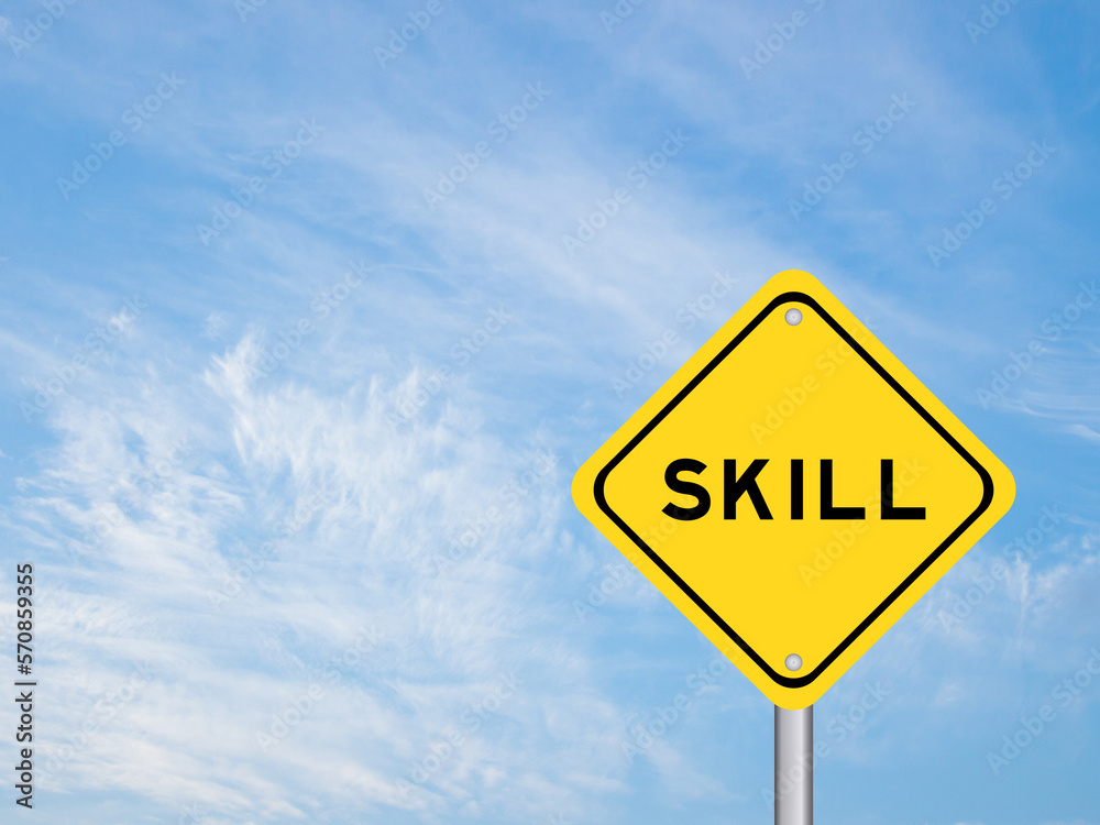 Naklejka premium Yellow transportation sign with word skill on blue color sky background