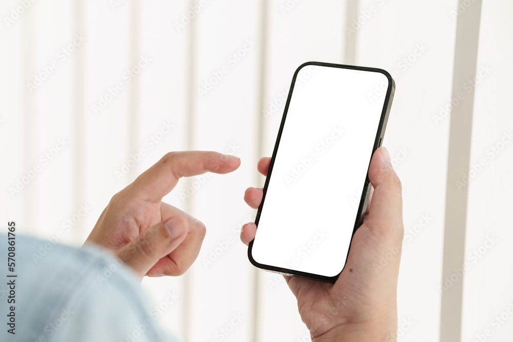 Close up of Man holding mobile phone with white background.