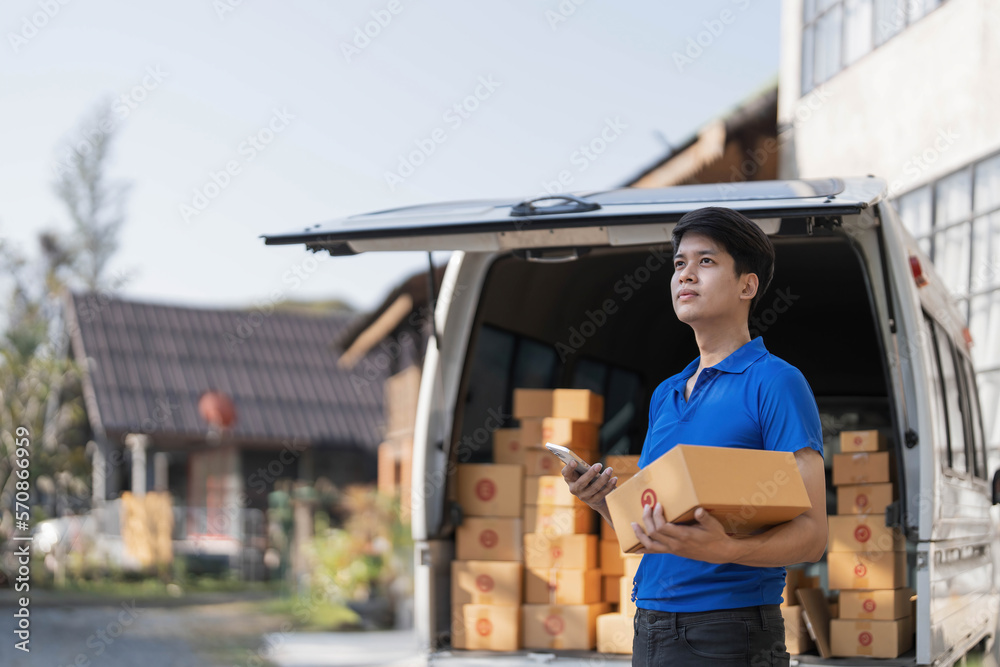 Asian young delivery man courier in uniform hold documents clipboard and box checking list parcel post boxes near a car for service shipment to customer, Online shopping service concepts