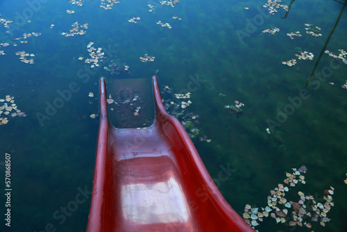 Fototapeta Naklejka Na Ścianę i Meble -  Waterslide to the lake after season, Solina Lake, Bieszczady, Poland