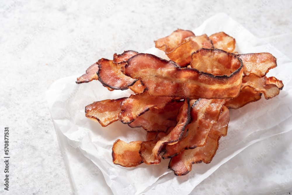 Crispy Cooked bacon rashers on parchment
