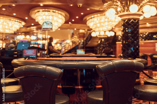 interior of elite luxury vip casino with poker tables photo