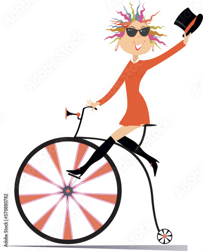 Young woman rides on a vintage bike. Sexy young woman with a top hat riding on a penny-farthing. Isolated on white background 