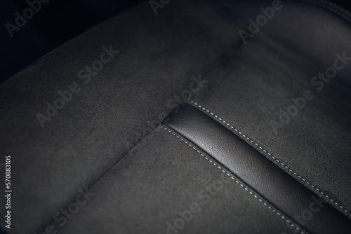 Close up view of modern car leather seat at the luxury interior
