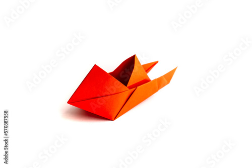 boat made of origami paper on a white background. origami.