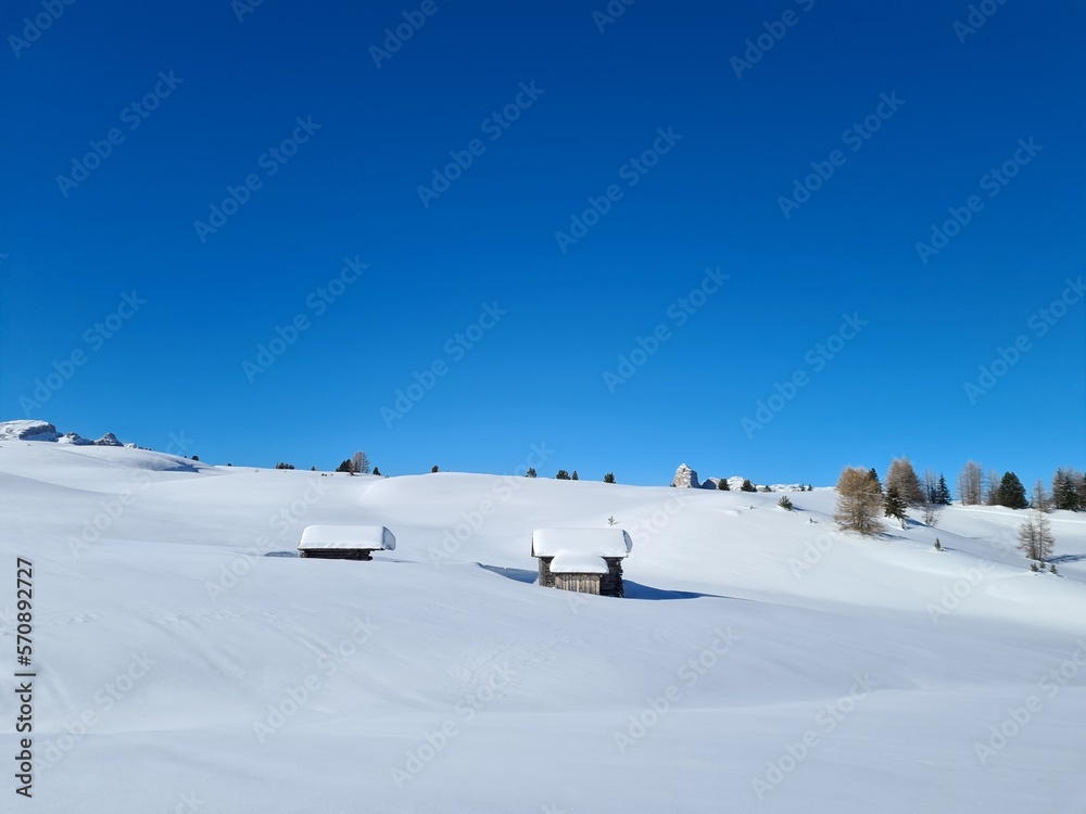 Amazing winter landscape in Italian Alps. Winter panorama with ski huts in the snow. beautiful bright sky in winter wonderland alps. Amazing winter landscape in Italian Alps. Winter panorama with ski huts in the snow. beautiful bright sky in winter wonderland alps.