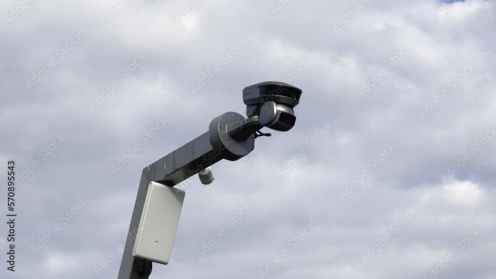 Security video camera moving to scan the area for surveillance purposes. Robotic CCTV recording technology. Security video camera moving to scan the area for surveillance purposes. Robotic CCTV recording technology.