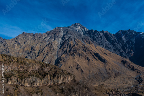 Georgia : 10-11-2022 : Country of Georgia, Kazbegi, Panoramic landscape of beautiful natural mountains, view of amazing Caucasus mountain peaks and meadows in Kazbegi national park