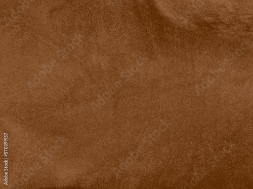 Brown color velvet fabric texture used as background. Empty brown fabric background of soft and smooth textile material. There is space for text...