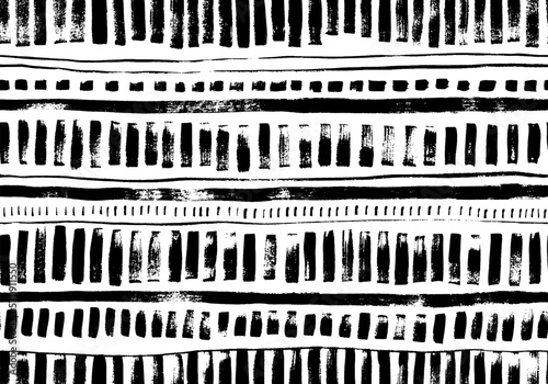 Hand drawn geometric seamless pattern. Vector tribal design background. Brush drawn stripes, dashes and dots. Ethnic ornament with simple motif. Vector monochrome ornament for wrapping paper, textile.