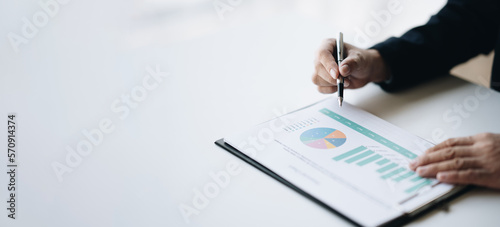 Quadro em tela Professional businessman or investor looking at the company chart, trying to analyse the budget