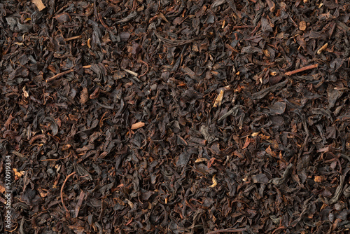 Indonesian Java Melange dried tea leaves close up full frame as background