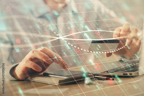 Double exposure of man hands holding a credit card and Forex graph drawing. Stock trading and digital fintech in Internet E-commerce concept.