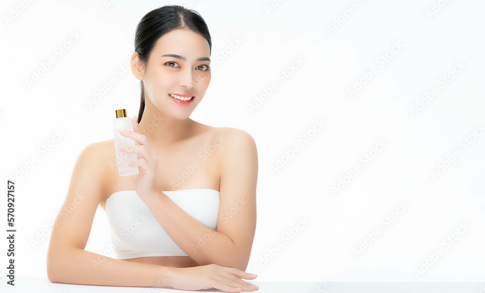 Beauty young woman hold face serum cosmetic bottle smiling face Beautiful Asian female showing skincare bottle product Beauty face body portrait isolated on white background copy space Present product Beauty young woman hold face serum cosmetic bottle smiling face Beautiful Asian female showing skincare bottle product Beauty face body portrait isolated on white background copy space Present product
