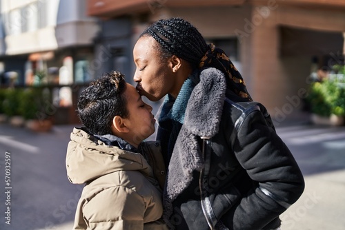 African american mother and son smiling confident standing together kissing at street © Krakenimages.com
