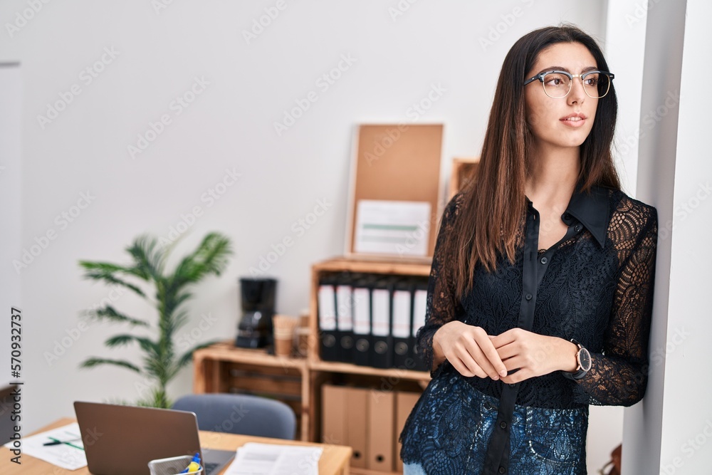 Young beautiful hispanic woman business worker smiling confident standing at office Young beautiful hispanic woman business worker smiling confident standing at office