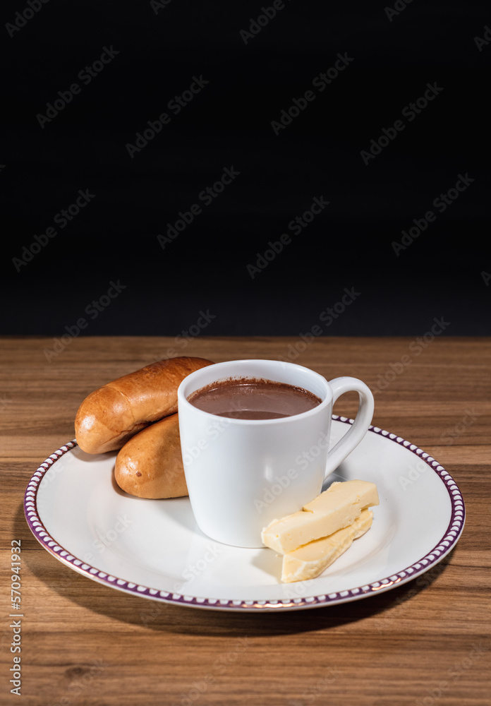 Obraz premium Hot chocolate drink with cheese and bread, Vertical image, wooden background