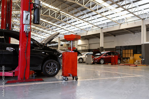 car in automobile repair service center with soft-focus and over light in the background