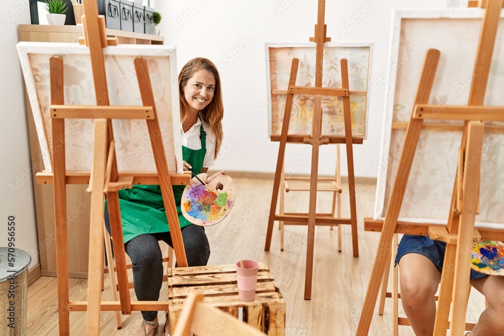 Mother and daughter smiling confident drawing at art studio Mother and daughter smiling confident drawing at art studio