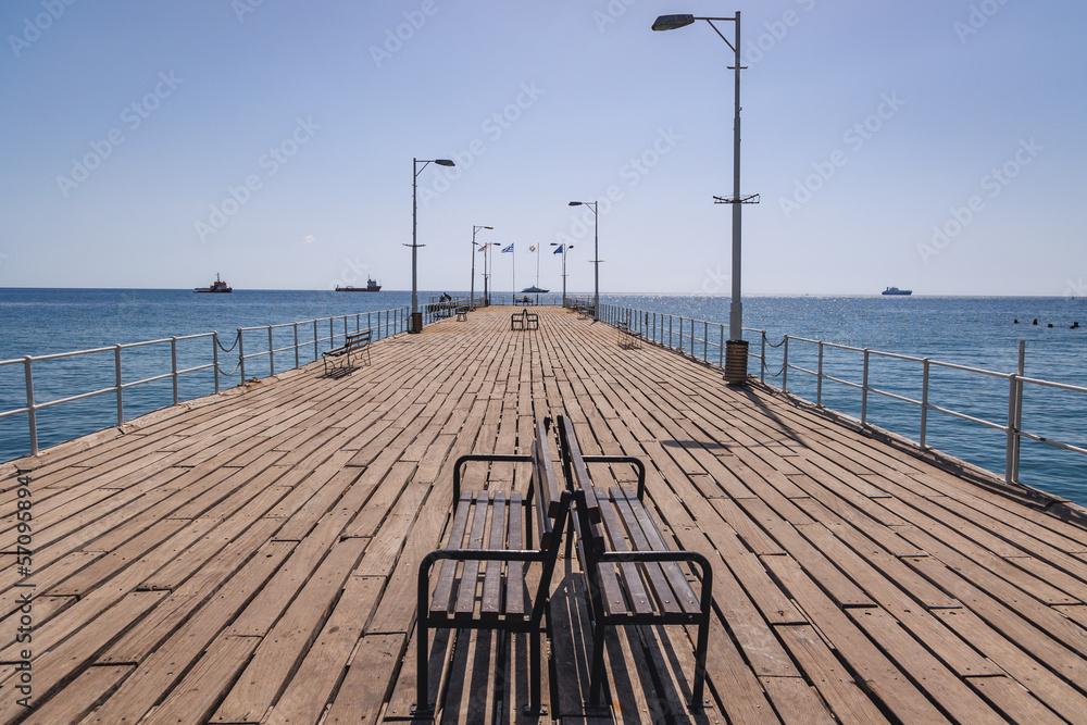 Naklejka premium Tourists pier in Molos sea front park of Limassol city in Cyprus island country